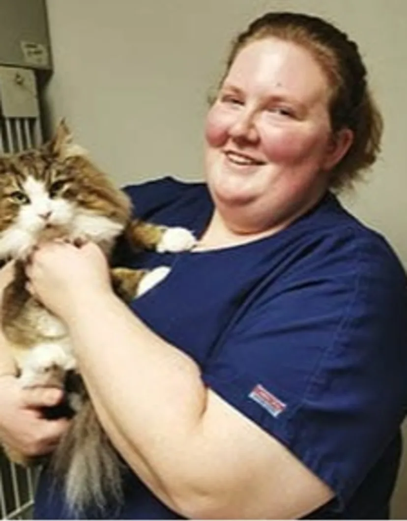 Megan - RVT holding orange and white cat at Animal Care Clinic West & Metro Cat Hospital